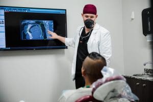 Dental Membership Patient Looking at an X-Ray