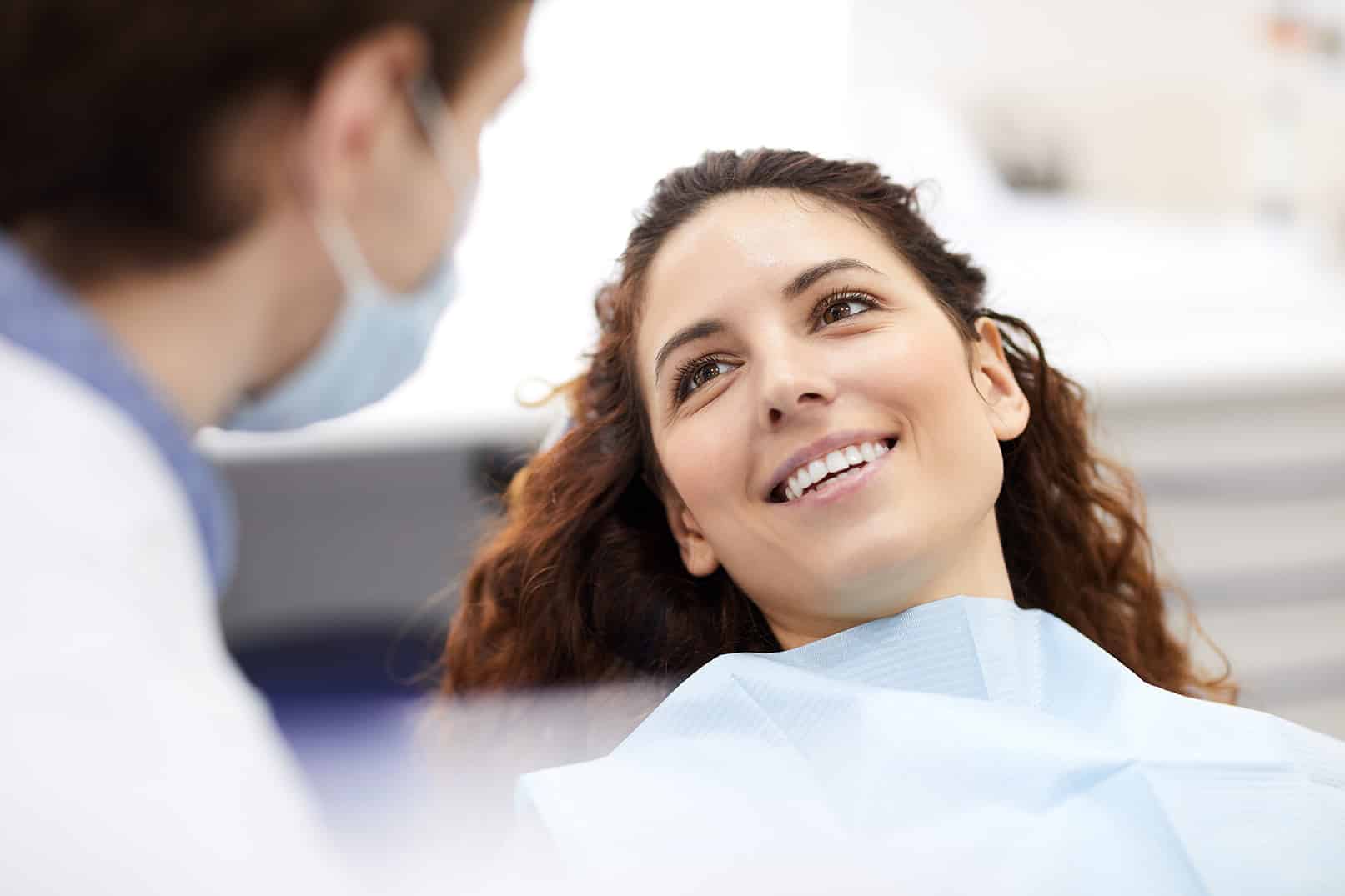 woman talking to dr turner during laser dentist appointment at the dentistry on monroe